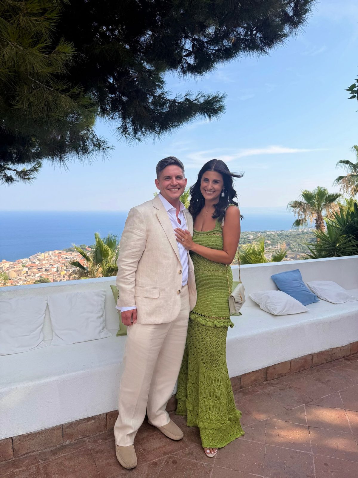 Eli and Ashley on a terrace overlooking the Mediterranean coast