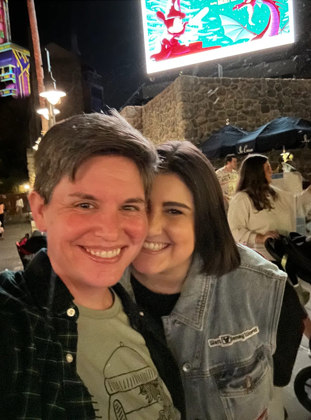 Nighttime selfie of Ashley and Eli at a Disney park